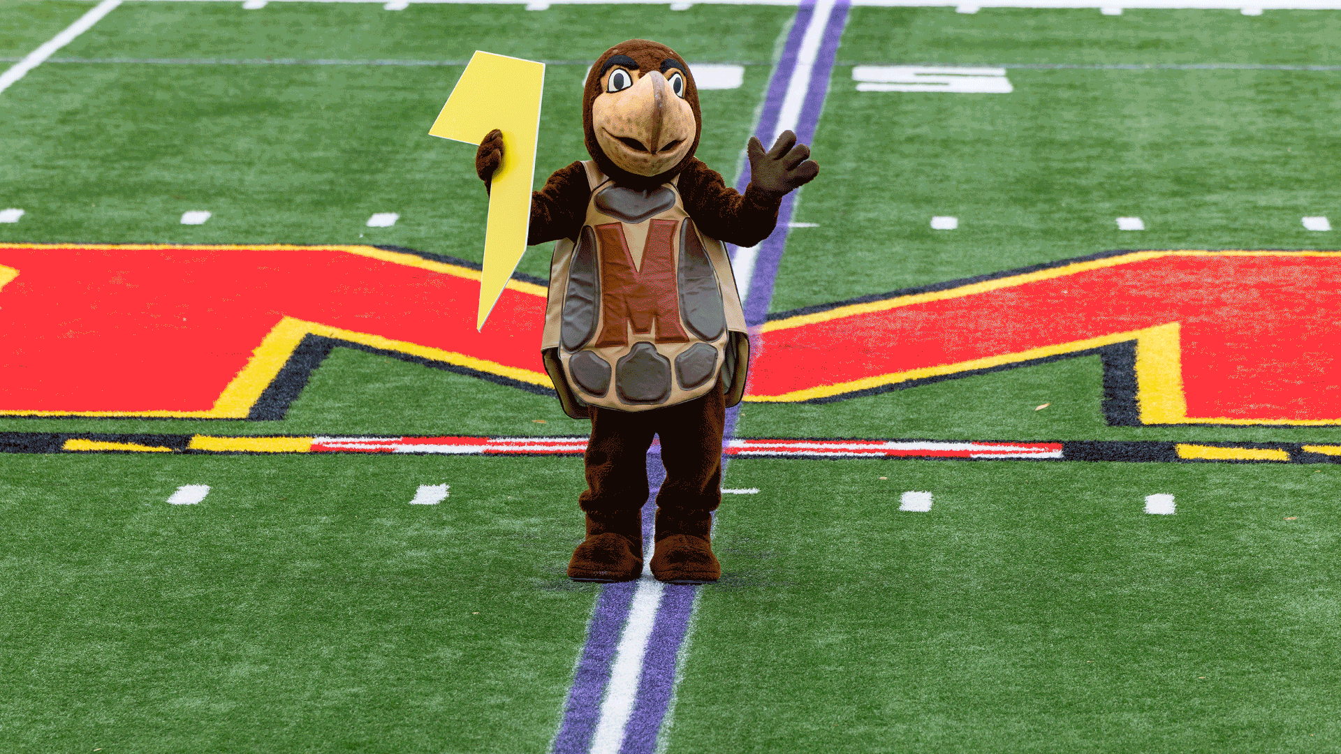 Testudo dancing with Fearlessly Forward gold arrow