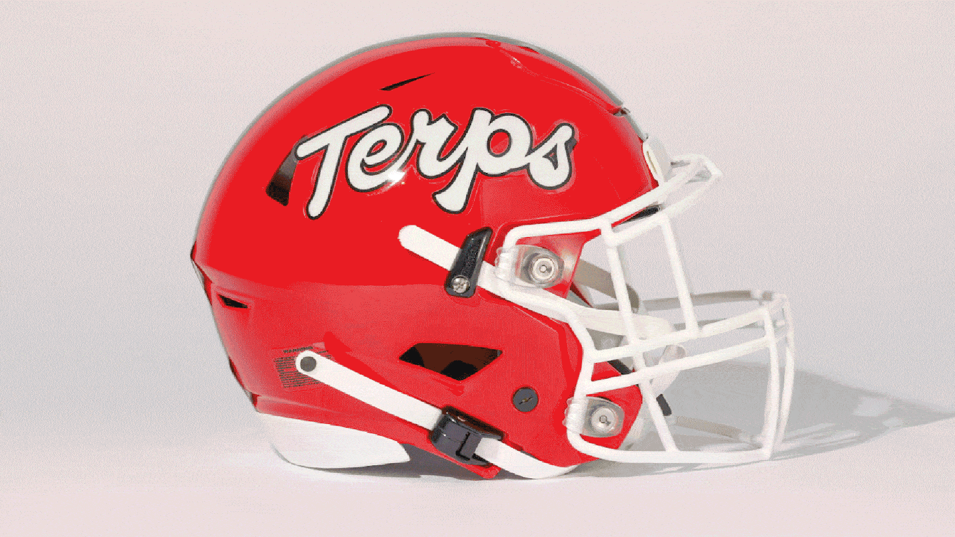 GIF showing Terp football helmets over the years