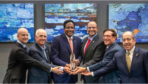 From left, University of Maryland College Park Foundation Board of Trustees Chair Paul Mandell, UMCPF Trustee Ray Ferrara, University of Maryland President Darryll J. Pines, Chief Investment Office Sam Gallo, UMCPF Trustee Eric Francis and UMCPF President Brodie Remington display the award for Endowment of the Year on behalf of the University of Maryland.
